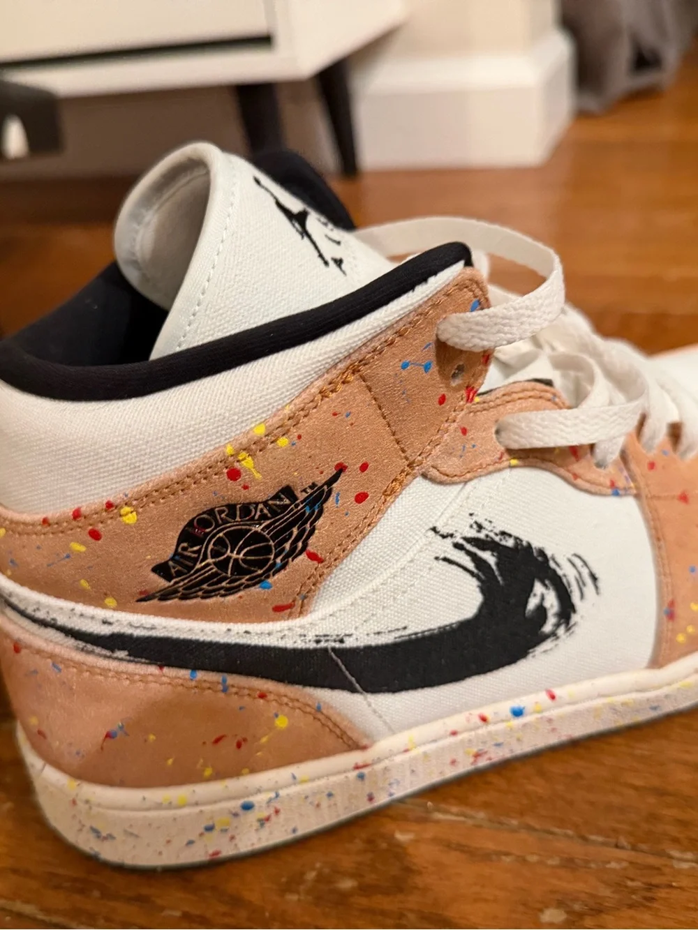 Jordan 1 Mid SE sneakers in sail/black-cider red.